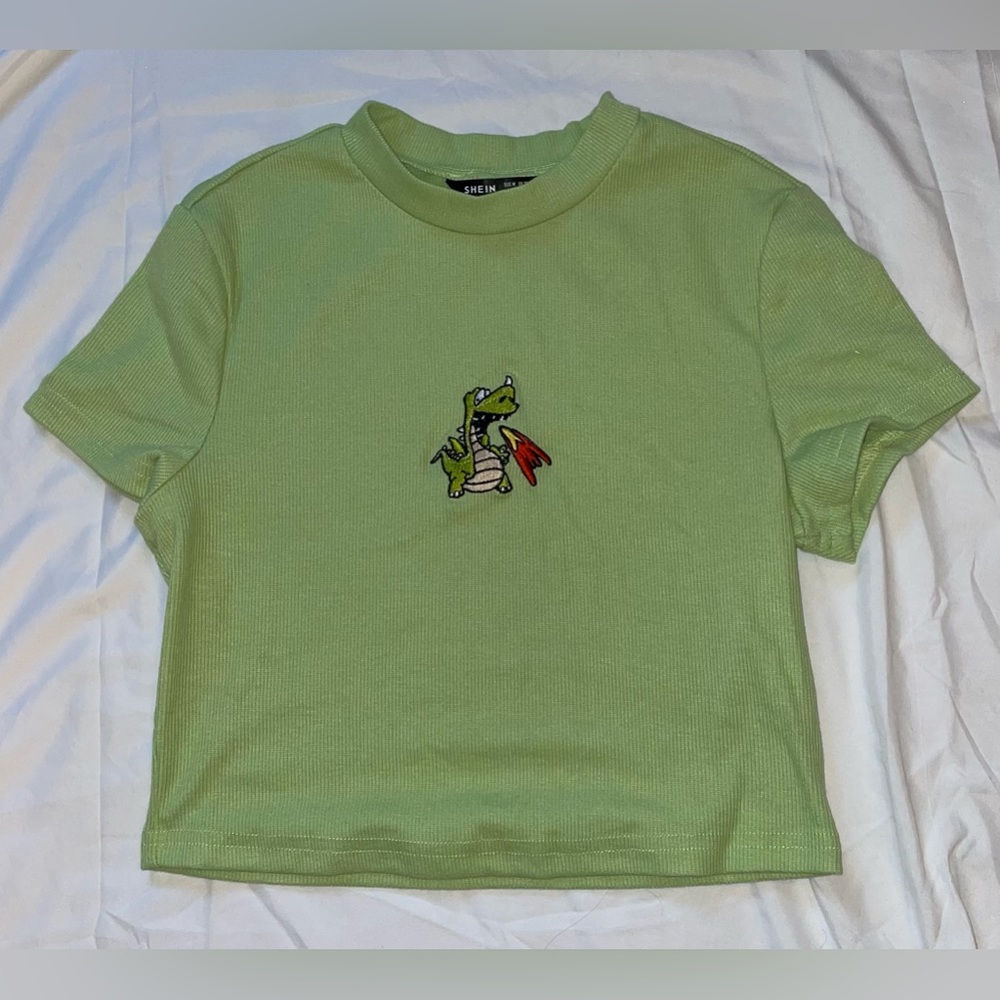 I am selling a green cropped t-shirt. It is a size medium.